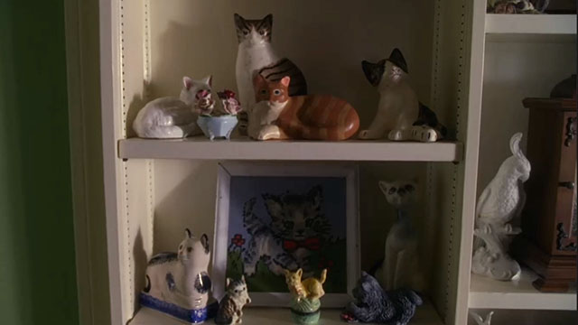 House, M.D. - Airborne - cat knick knacks and figures on shelf