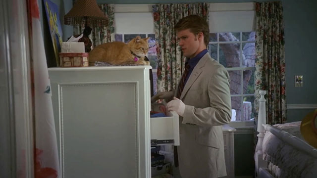 House, M.D. - Airborne - Dr. Chase Jesse Spencer in bedroom with ginger and white tabby cat Harrington on dresser
