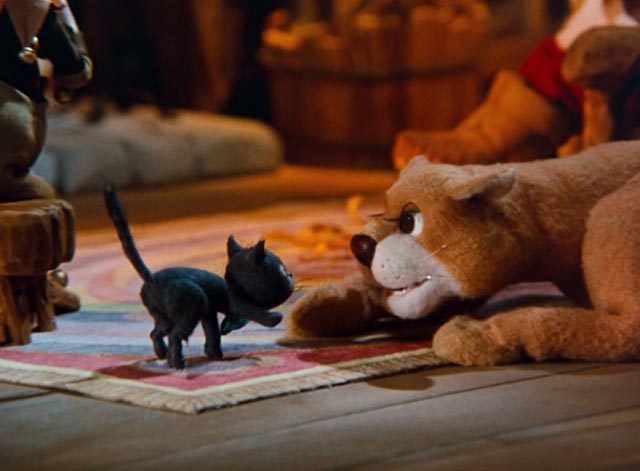 The Life and Adventures of Santa Claus - black cat Blinky and lioness Shiegra looking at each other