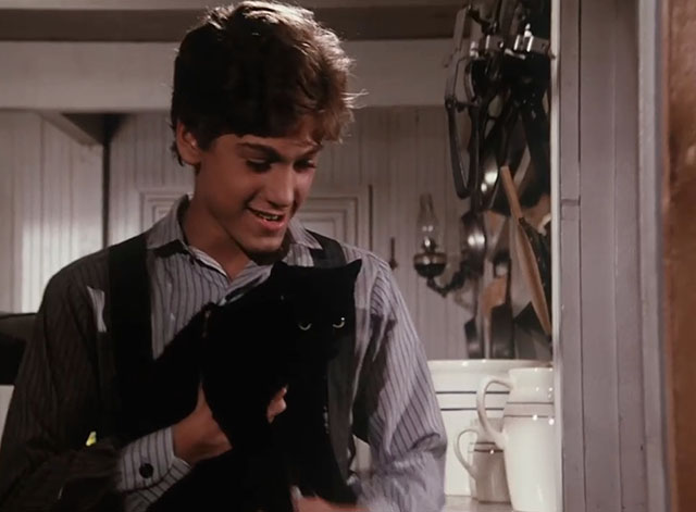 Little House on the Prairie - Gambini, the Great - Willie Jonathan Gilbert carrying black cat Pepper from mercantile