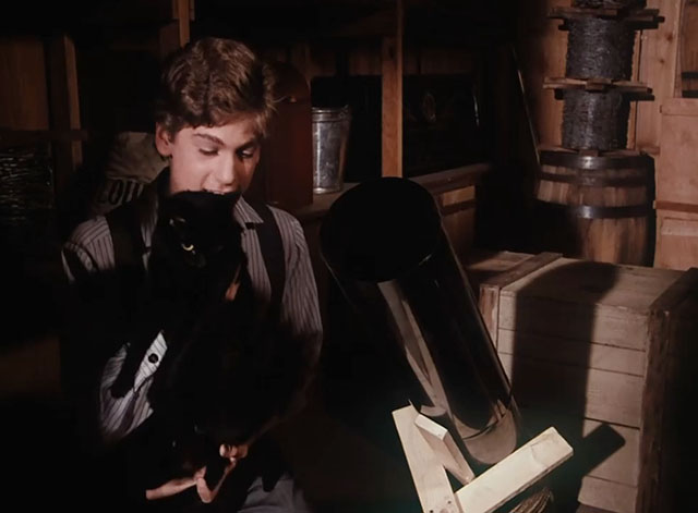 Little House on the Prairie - Gambini, the Great - Willie Jonathan Gilbert holding black cat Pepper near makeshift cannon