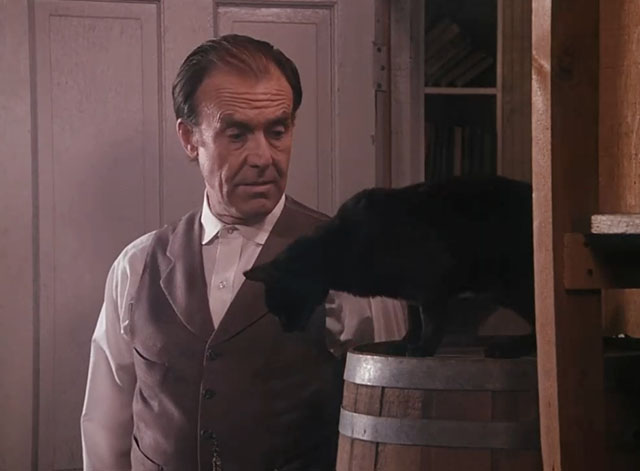 Little House on the Prairie - Gambini, the Great - Nels Richard Bull looking at black cat Pepper on barrel