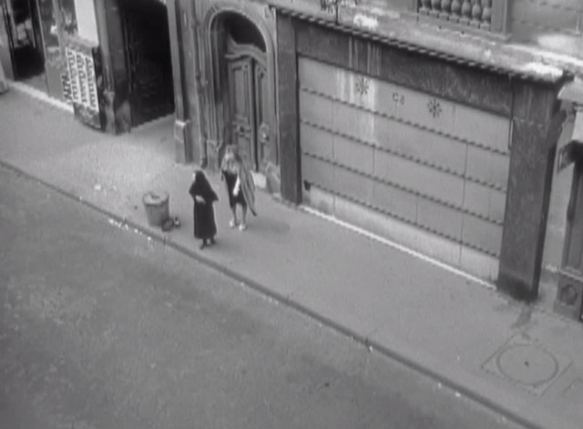 Maigret - A Crime for Christmas - Donceur Esma Cannon and Martin Heather Chasin standing near cat by trash can on street