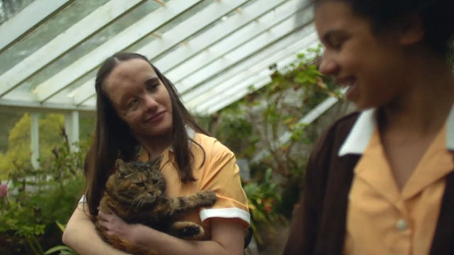 Malory Towers - The Stray - Jean Beth Bradfield holding torbie cat Kenny with Ellen Carys John