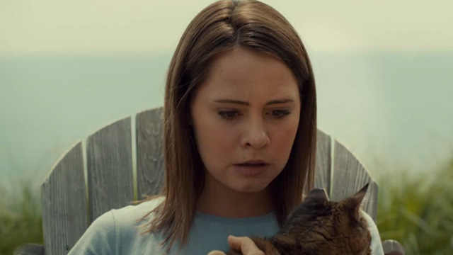 Mary Kills People - Morning Glory - Jess Abigail Winter holding up tabby cat Casper