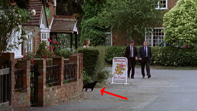 Midsomer Murders - The Animal Within - Barnaby John Nettles and Jones Jason Hughes walking past tuxedo cat