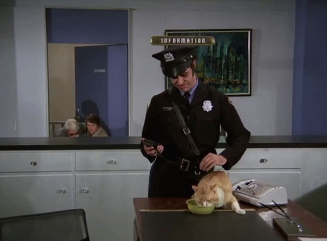 Mission: Impossible - Blind - security guard Calvin Chrane feeding ginger and white cat on desk with Phelps Peter Graves and Johnny Peter Brown behind