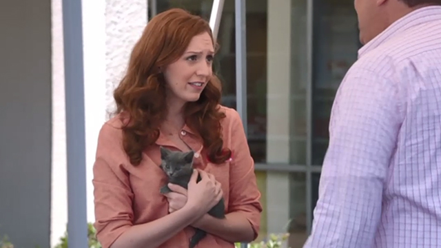 Modern Family - Bringing Up Baby - adoption worker Emily Happe holding gray kitten