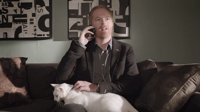 Modern Family - Diamond in the Rough - Larry Frosty cat being petted on Mitchell's Jesse Tyler Ferguson's lap