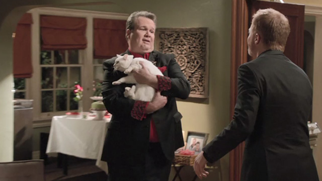 Modern Family - Heart Broken - Larry Frosty cat being held by Cameron Eric Stonestreet with Mitchell Jesse Tyler Ferguson