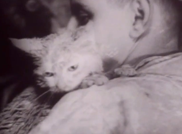 Modern Marvels - Grand Coulee Dam - newsreel footage of white cat Evelyn wet and dirty held by worker