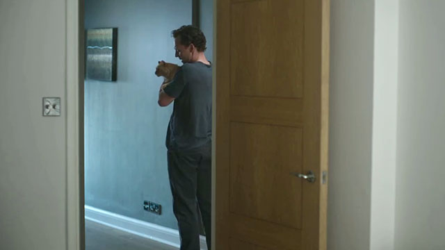 The Night Manager - Season 2, Episode 1 - Alex Jonathan Tom Hiddleston holding longhair ginger tabby cat Corky