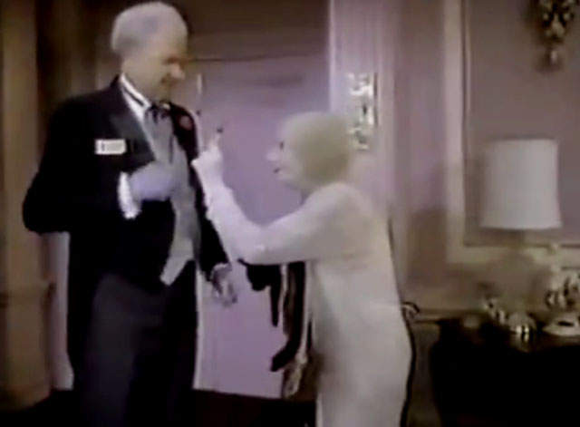 The Nutt House - Pilot - Mrs. Nutt Cloris Leachman holding black cat and giving Reginald Harvey Korman a lollipop