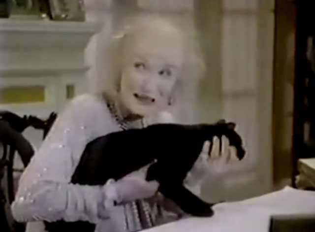 The Nutt House - Pilot - Mrs. Nutt Cloris Leachman holding black cat on desk