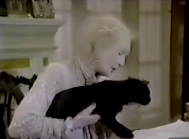 The Nutt House - Pilot - Mrs. Nutt Cloris Leachman holding black cat on desk