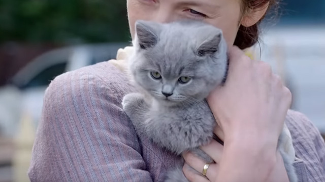 Outlander - Perpetual Adoration - Claire Caitriona Balfe holding English shorthair kitten Adso Bear