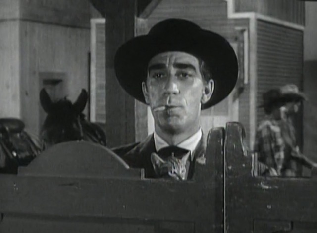 The Rifleman - The Spiked Rifle - Stark standing in front of saloon with tabby kitten