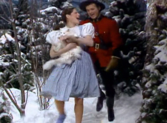 Saturday Night Live - The Incredible Man - Jennifer Gilda Radner bouncing white Persian cat Tinky as she skips along with Mountie Bill Murray
