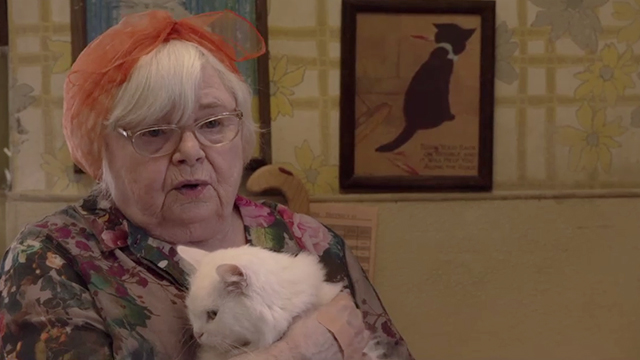 Shameless - Own Your Sh*t - Etta June Squibb in laundromat holding white cat