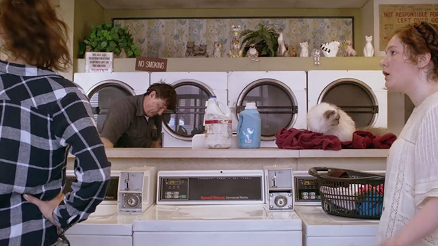 Shameless - Own Your Sh*t - Fiona Emmy Rossum in laundromat with numerous cats