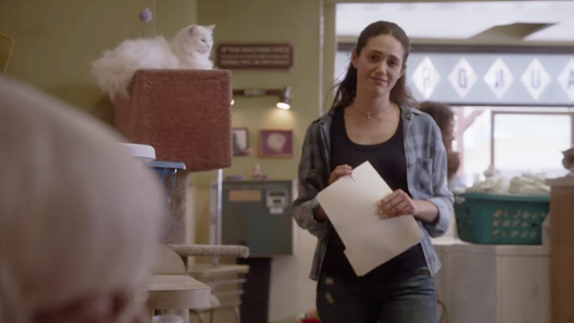 Shameless - The Defenestration of Frank - Fiona Emmy Rossum standing in laundromat with white cat nearby