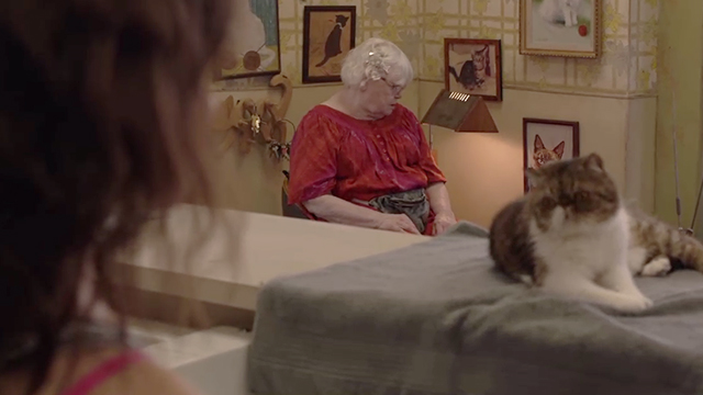 Shameless - Own Your Sh*t - Etta June Squibb in laundromat with McMahon exotic shorthair cat