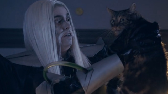 Space Riders: Division Earth - Orson Ooze holds up tabby Portal Cat