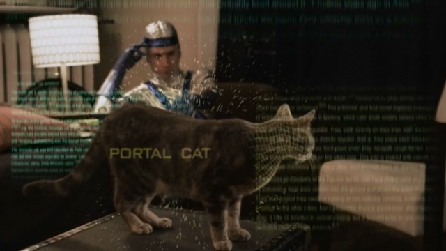 Space Riders: Division Earth - Philip scanning tabby Portal Cat from couch
