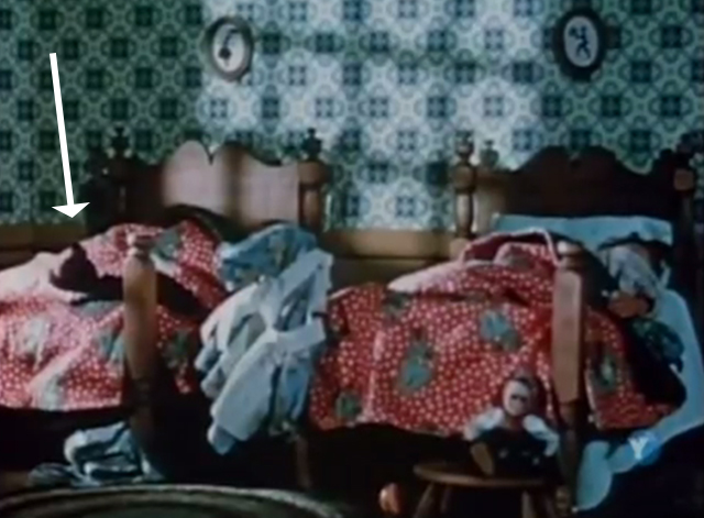The Spirit of Christmas- The Night Before Christmas - black kitten puppet lying on bed