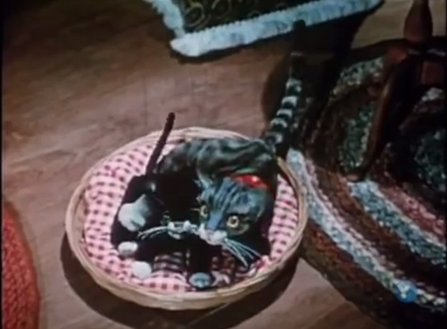 The Spirit of Christmas- The Night Before Christmas - cat puppets in basket in front of fireplace looking up