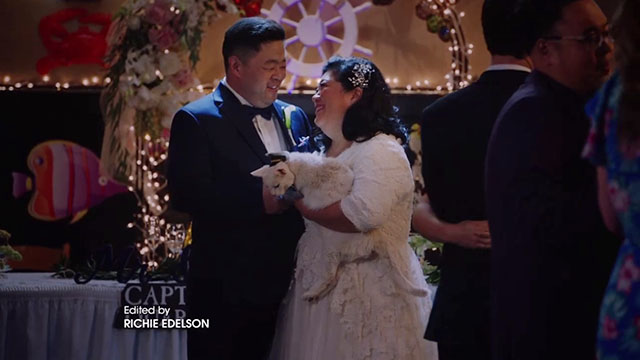 Superstore - Sandra's Wedding - Sandra Kaliko Kauahi and Jerry Chris Grace dancing with white cat Biscuit