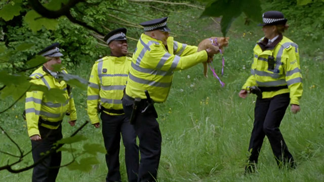 A Touch of Frost - If Dogs Run Free, Part One - police officer holding up ginger and white tabby cat to fellow officers
