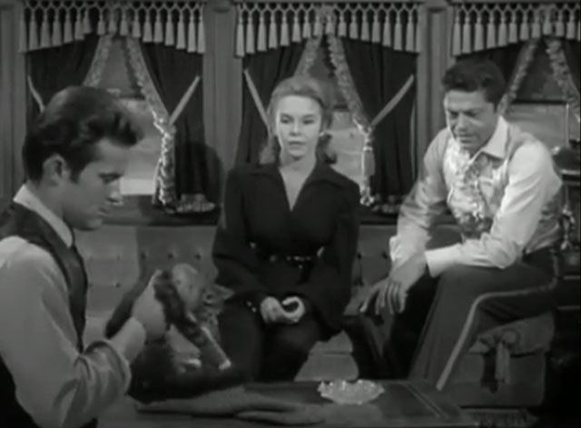 The Wild Wild West - The Night of the Dancing Death - James T. West Robert Conrad holding long haired kitten with Artemus Ross Martin and Marianna Ilse Taurins