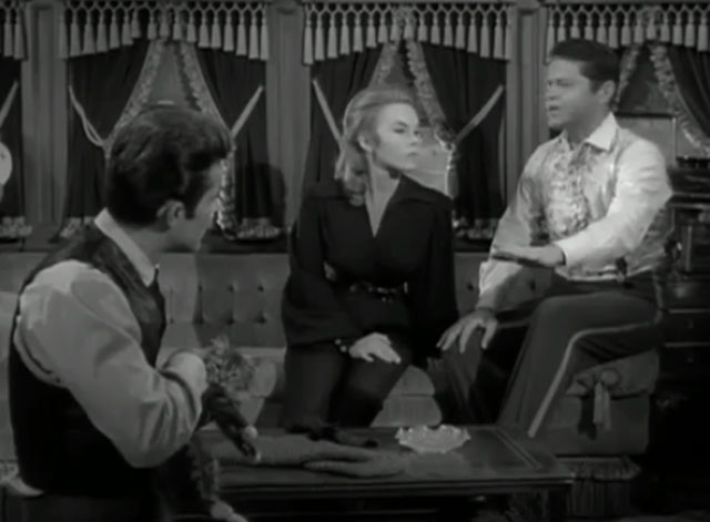 The Wild Wild West - The Night of the Dancing Death - James T. West Robert Conrad still holding long haired kitten with Artemus Ross Martin and Marianna Ilse Taurins