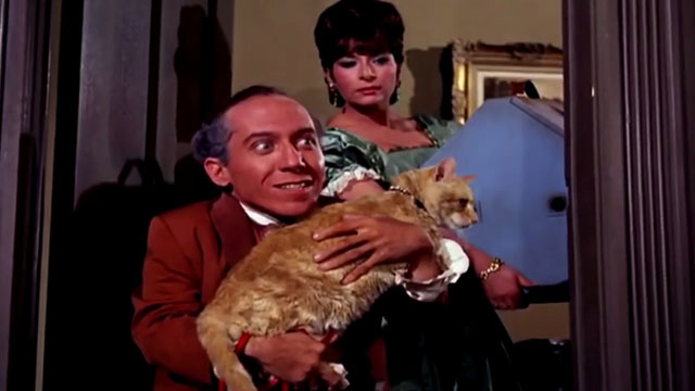 The Wild Wild West - The Night of the Raven - Dr. Loveless Michael Dunn holding orange tabby cat with Antionette Phoebe Dorin behind