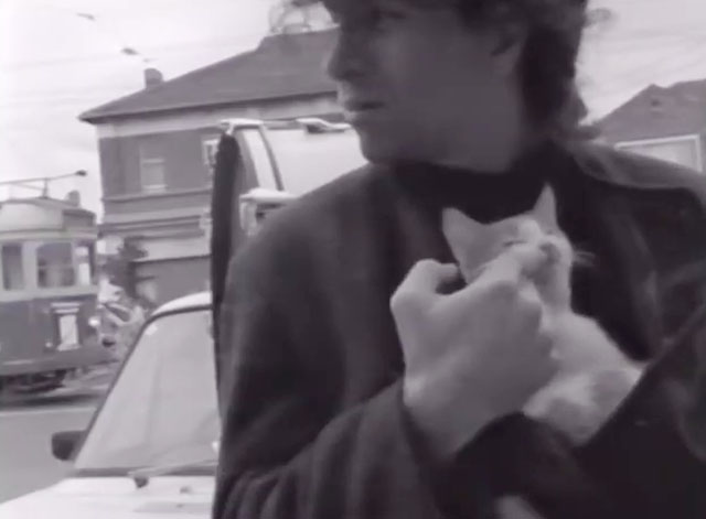 City Flat - Boom Crash Opera - Richard Pleasance holding tabby and white kitten