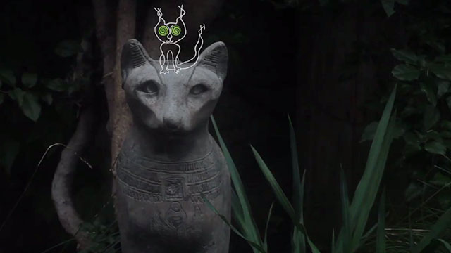 Ghost Cat - Ann Magnuson - cartoon cat on statue