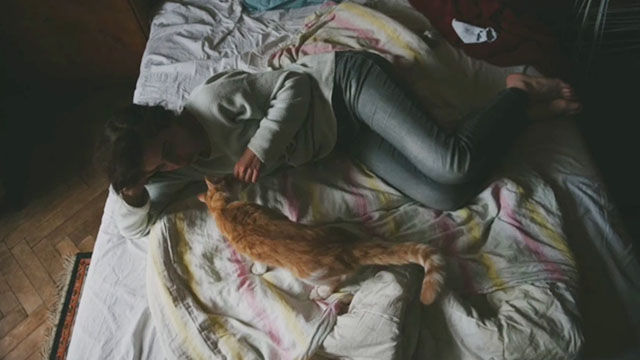 Green Pastures - The Silver Spoons - woman lying on bed with ginger and white tabby cat