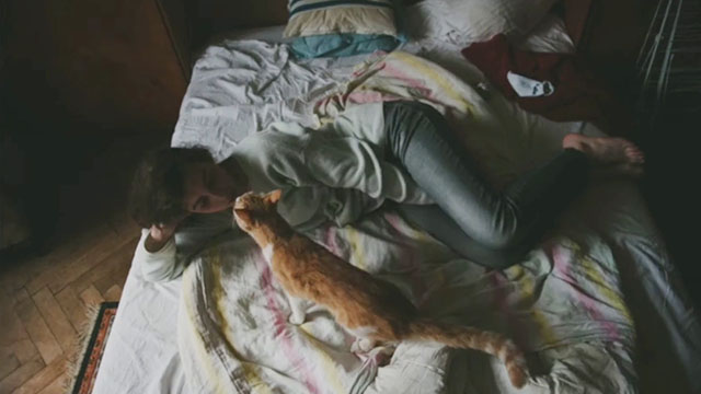 Green Pastures - The Silver Spoons - woman lying on bed with ginger and white tabby cat