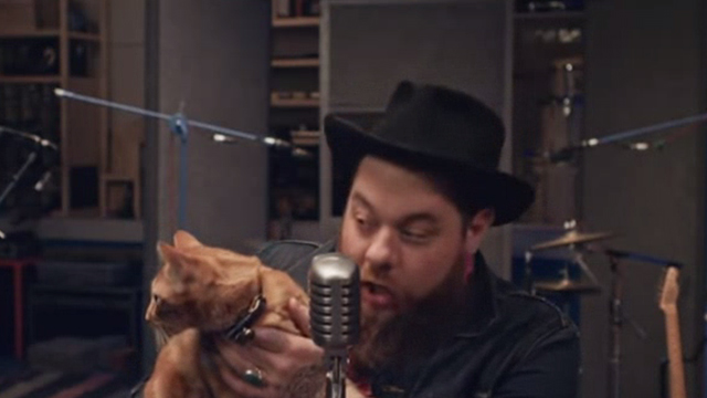 Nathaniel Rateliff and the Night Sweats - I Need Never Get Old - Nathaniel offering orange tabby cat some celery while recording