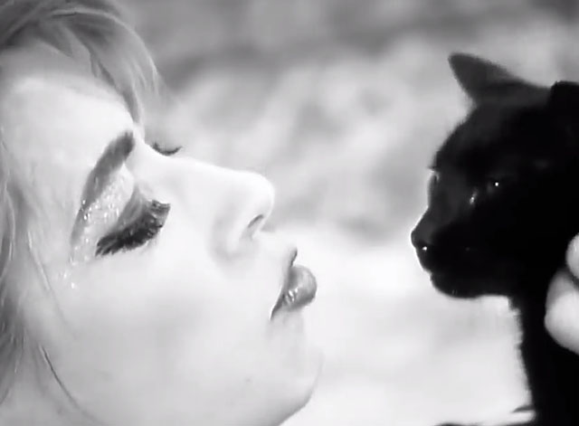 Kool Thing - Sonic Youth - Kim Gordon holding up black cat