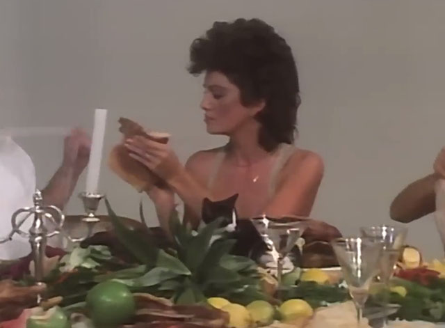 The One Thing - INXS - women and a tuxedo kitten feasting at table