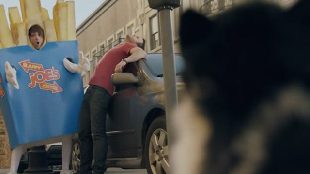 Something's Gotta Give - All Time Low - guy in french fry costume Alex Gaskarth approaches cat