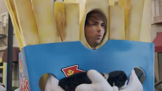 Something's Gotta Give - All Time Low - guy in french fry costume Alex Gaskarth holding fake cat