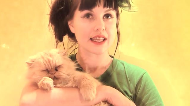 Yulia - Princess Chelsea - holding orange Persian cat Winston